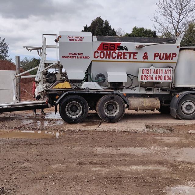 Man pouring concrete mix using a pump